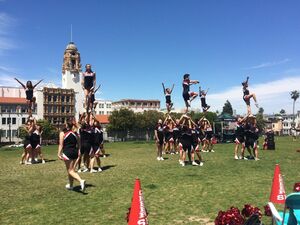Cheer squad performing in the park