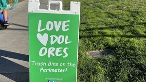 Love Dolores sign by the trash station
